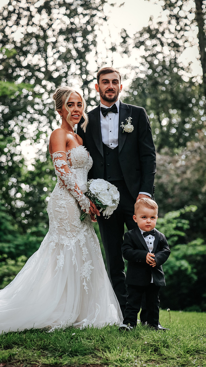 Couple with their little boy in the gardens