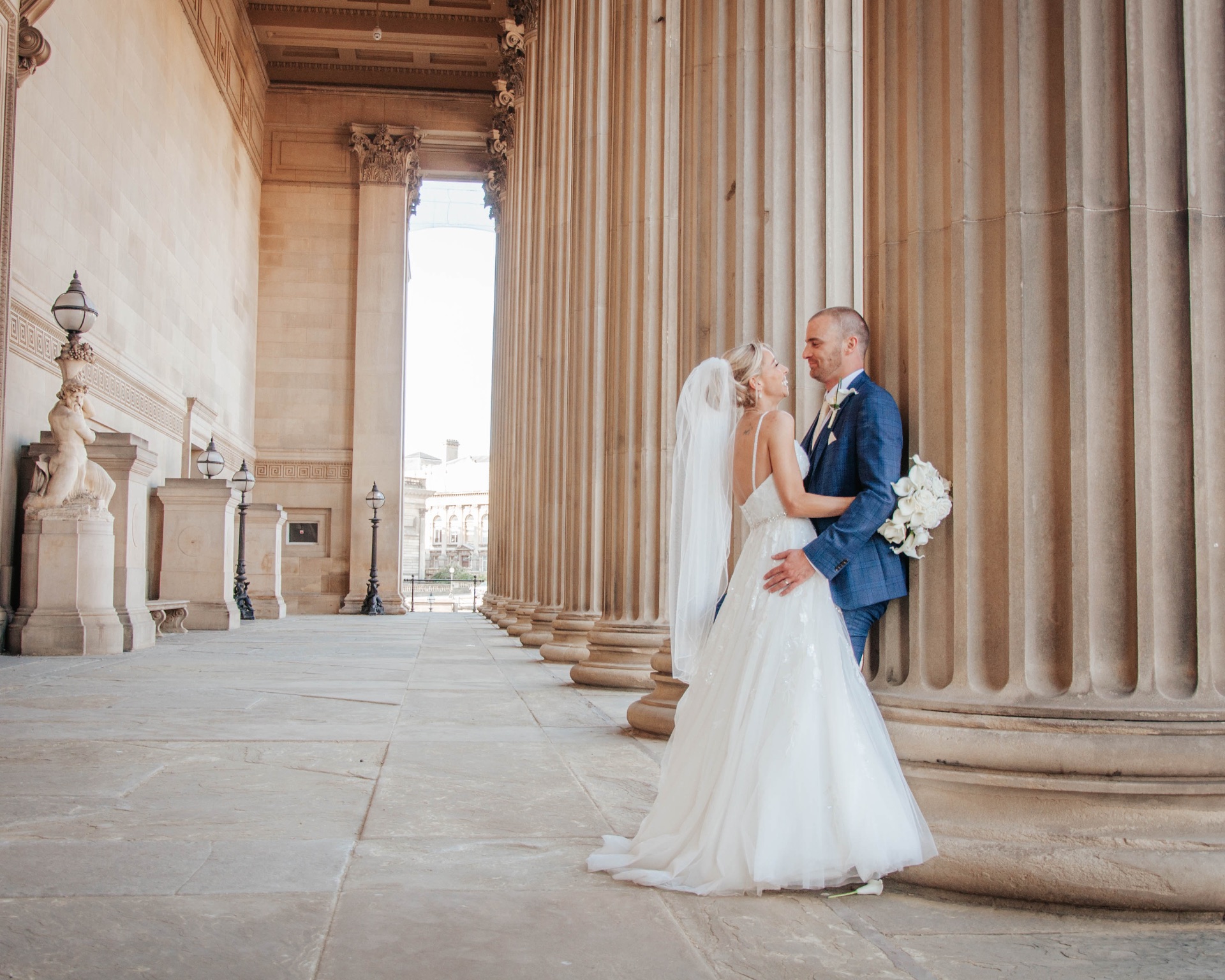 Couple among the columns of St George's Hall