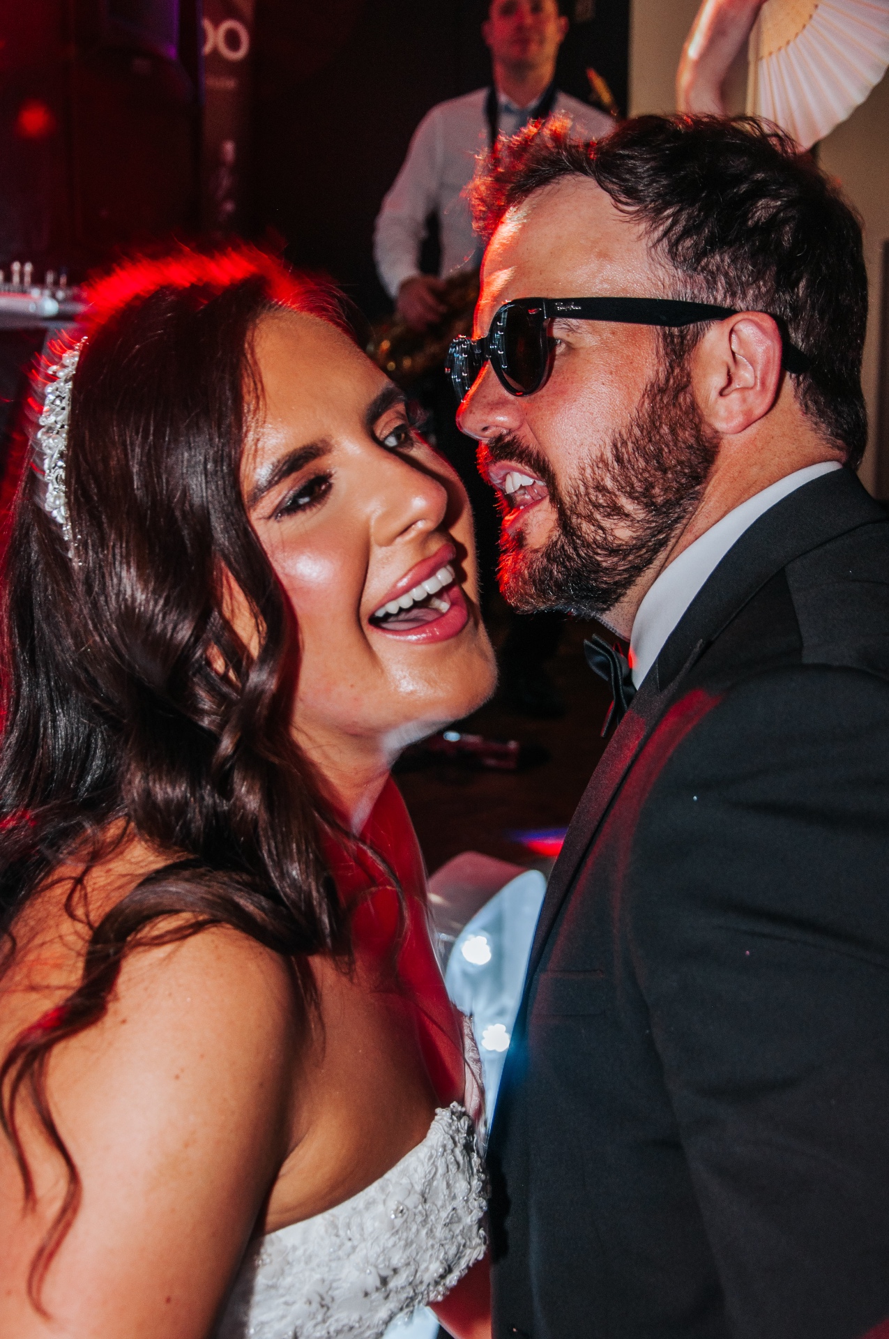 Bride and groom singing on the dance floor