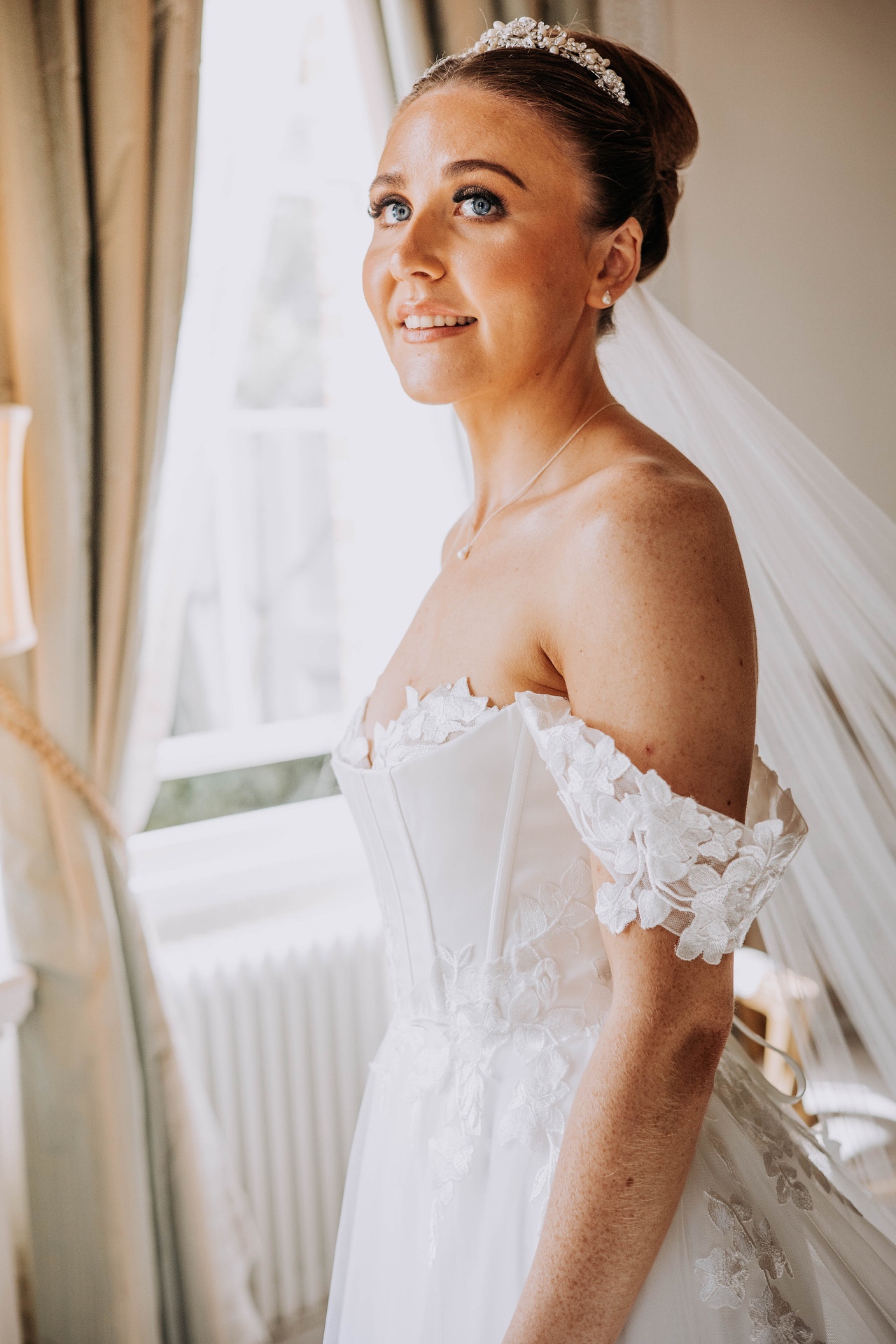 Bride by the window in morning light